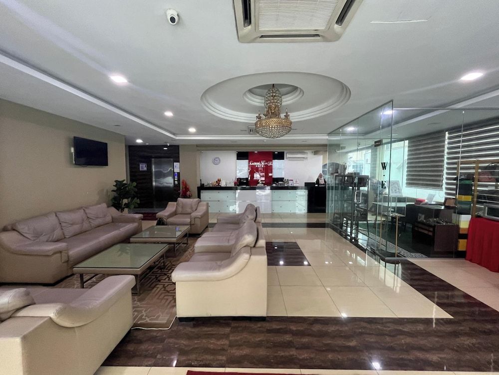 Capital O 91074 Grand World Hotel 3