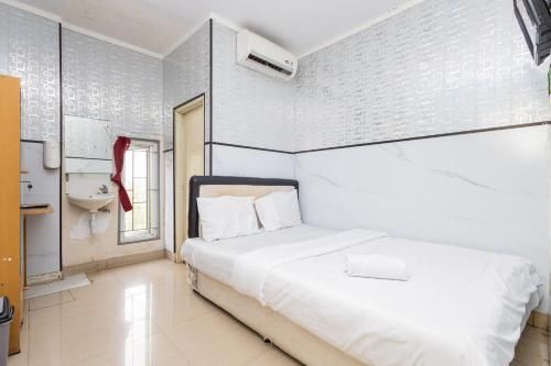 Alfa Guesthouse Serpong Mitra RedDoorz 3
