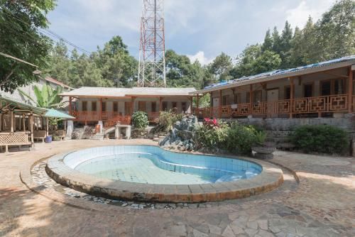 Urbanview Hotel D'Pineapple Villa Ciater by RedDoorz 3 étoiles à Subang