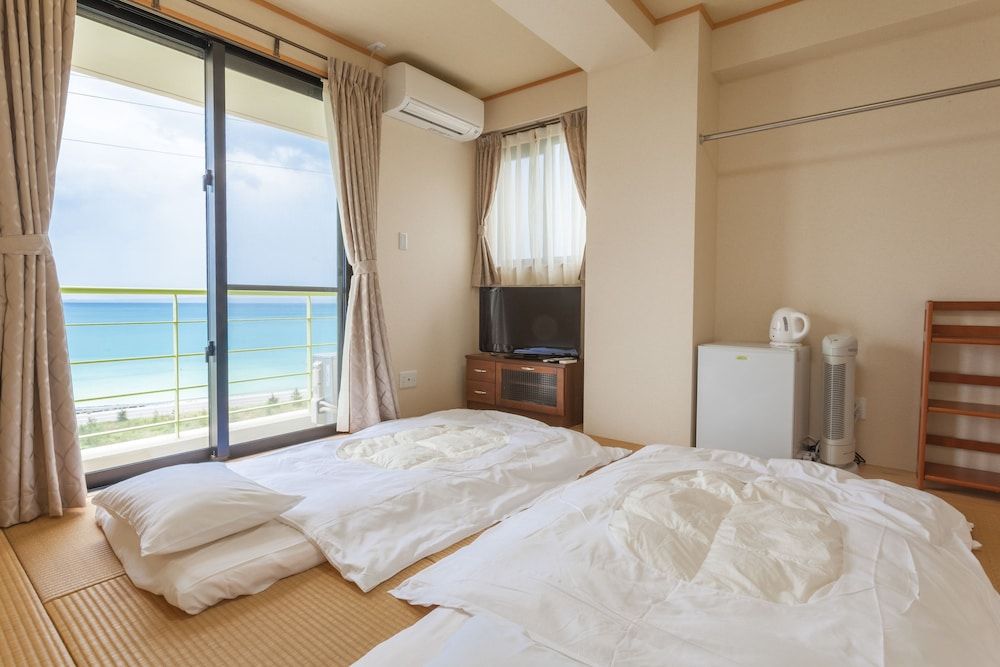 Ocean Hills Chouraku Stay -1 estrelas em Kin