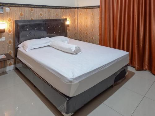 Homestay Singgasana Mitra RedDoorz 2 estrellas en Girian